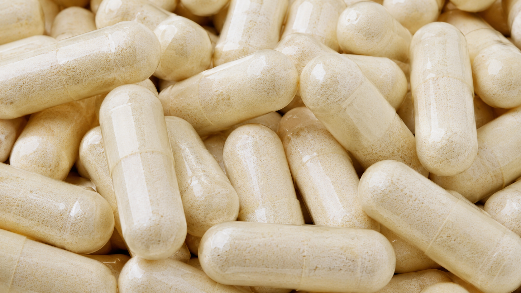 ORALEA Total Vitality colostrum capsules, close-up.